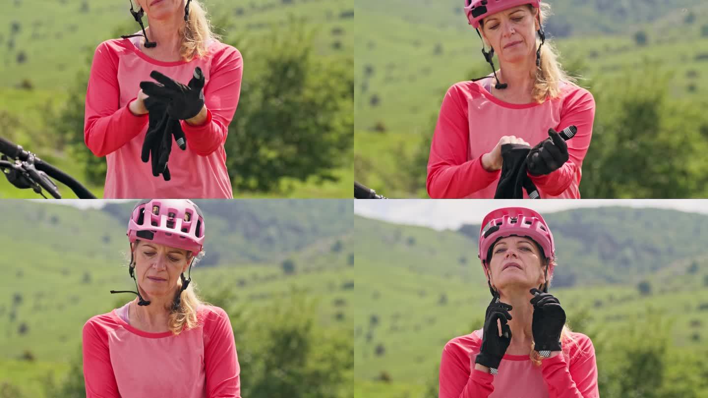 女山地自行车手在户外系好头盔
