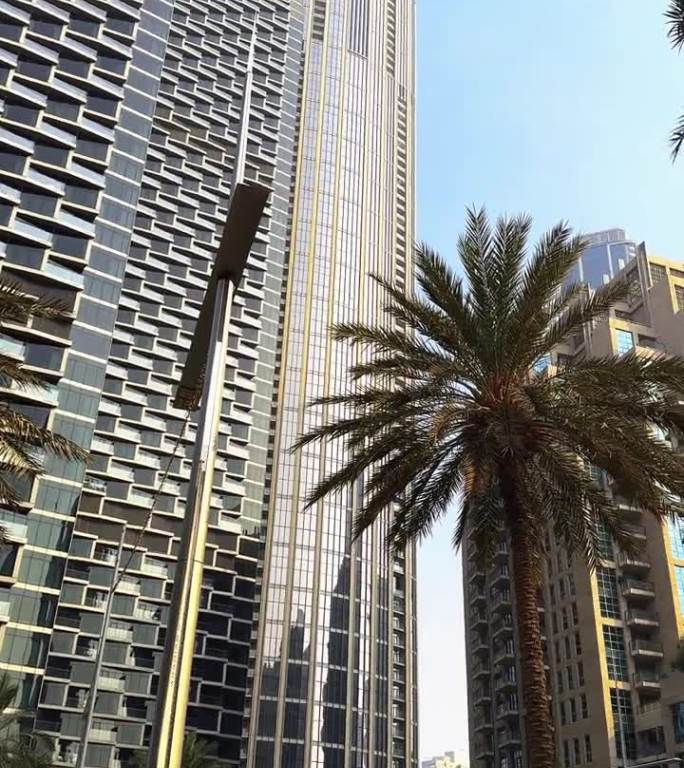 迪拜城市，白天的城市景观，白天蓝天的摩天大楼，哈利法塔特写。高质量的全高清镜头