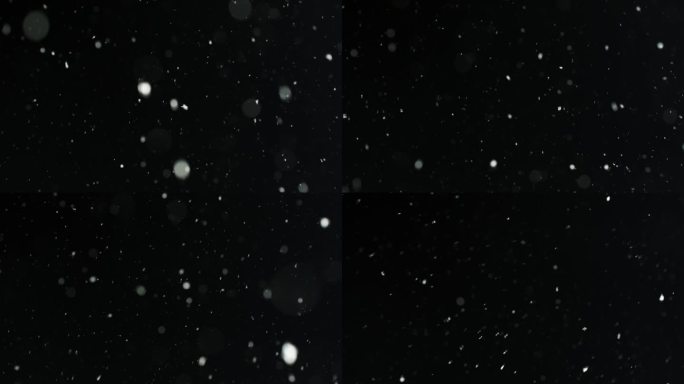 低角度锁定拍摄发光的降雪在夜晚的天空