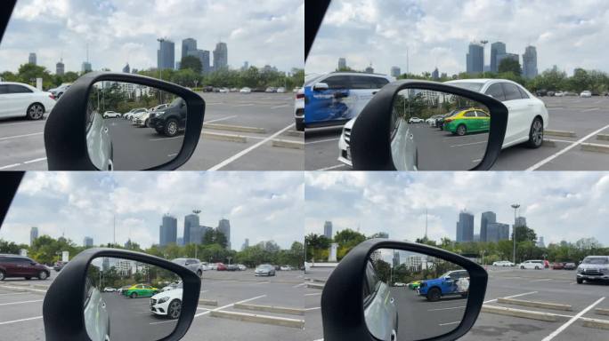 在曼谷市内开车。后视镜