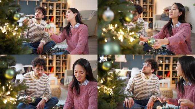 一名白人男子和一名日本女子，正在家中装饰圣诞树