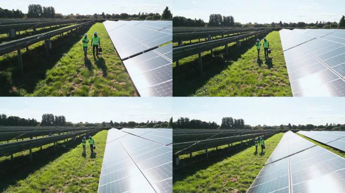 无人机拍摄的工程师在现场检查太阳能电池板产生可再生能源