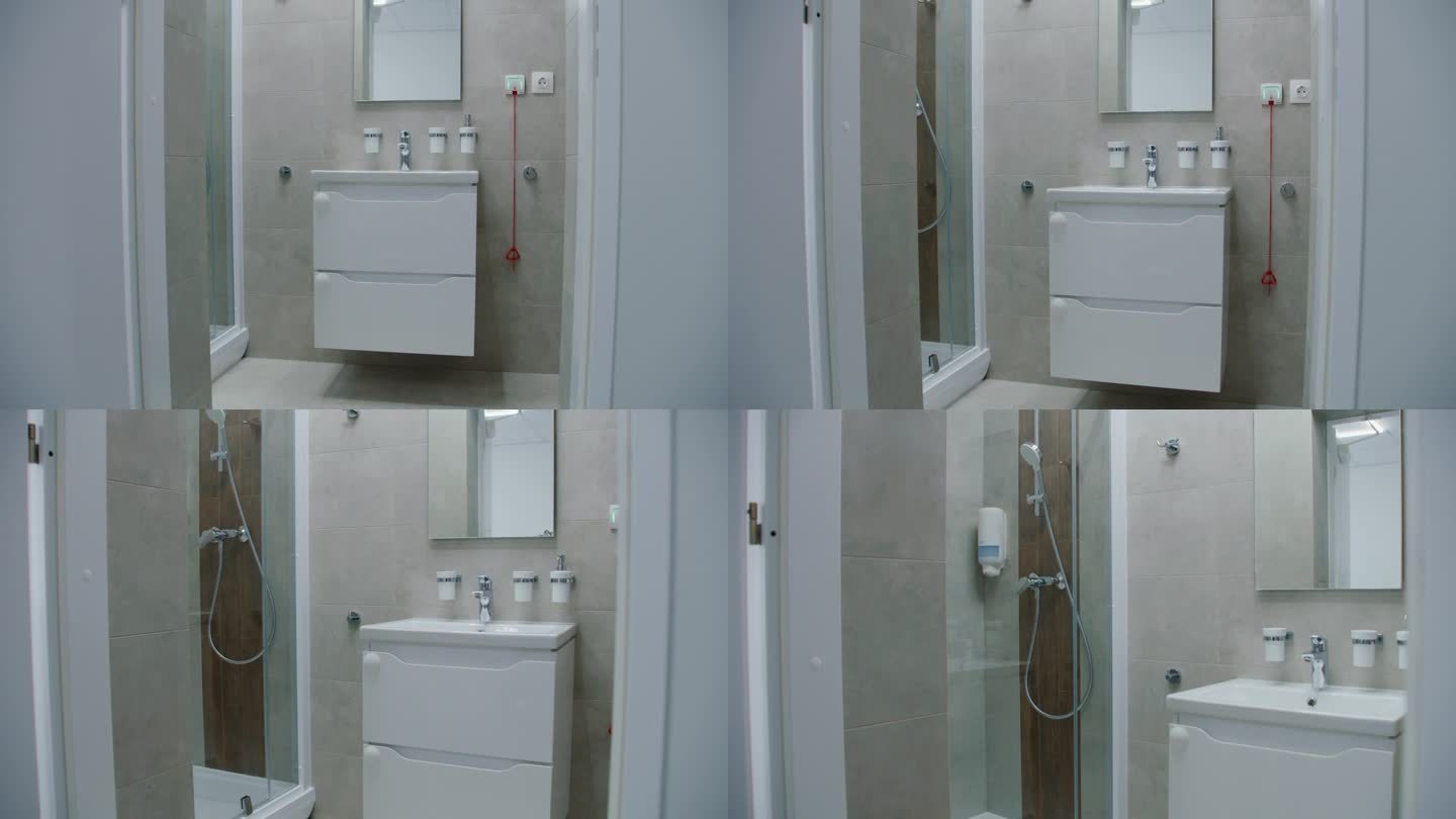 在明亮的浴室中间，白色的水槽上面有镜子