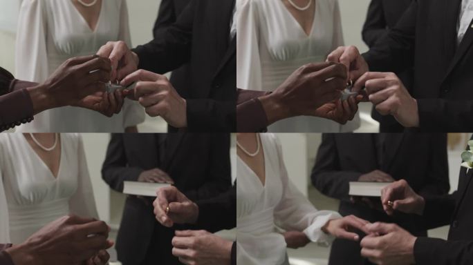 新郎在婚礼上给新娘戴上戒指