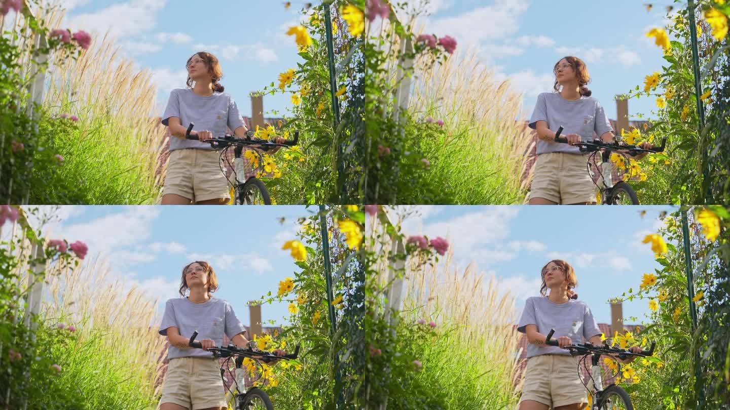 在后院的花丛中骑自行车的女人