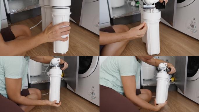 这位女士独立更换了滤水器，她插入了一个新的滤水器，然后把白色的烧瓶扭到她的位置上，坐在厨房的地板上。