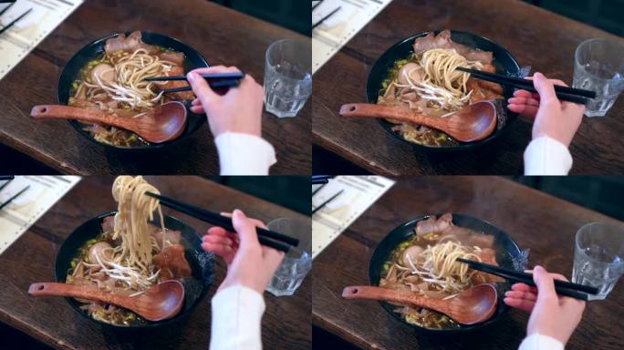 女人用筷子吃拉面汤