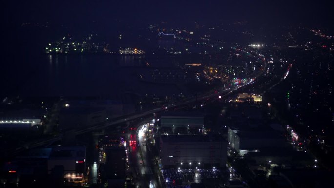 大阪关西国际机场海湾地区夜间延时鸟瞰海洋建筑照明4k