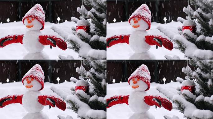 一个快乐的雪人，戴着红色羊毛帽和红色连指手套，站在积雪下，靠近一所房子的木制露台上的圣诞树
