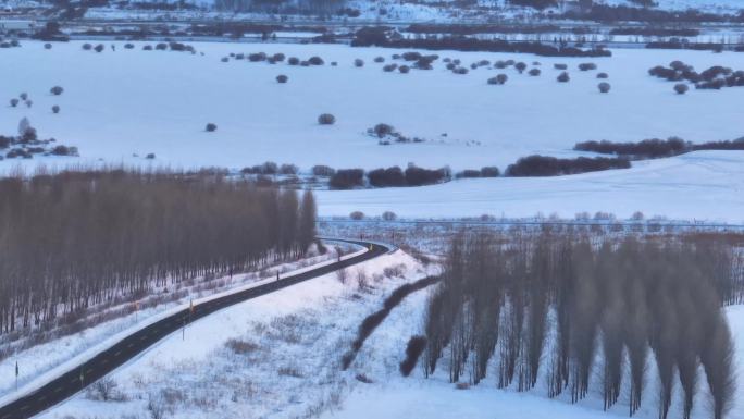 航拍雪景下的牙克石道路