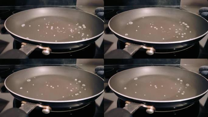 水溅到特氟龙锅上，蒸发得很快。特写镜头,静态的。Pfas的健康问题