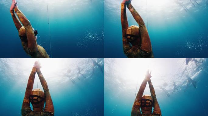 一名女子自由跳水者在绳索附近上升，摄像机围绕着模特旋转，并在水面上展示了自由跳水队