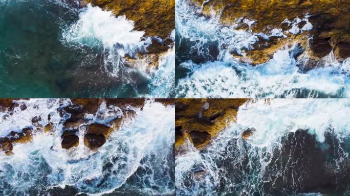 从空中俯瞰海浪撞击岩石的画面。海浪冲击着岩石峭壁。