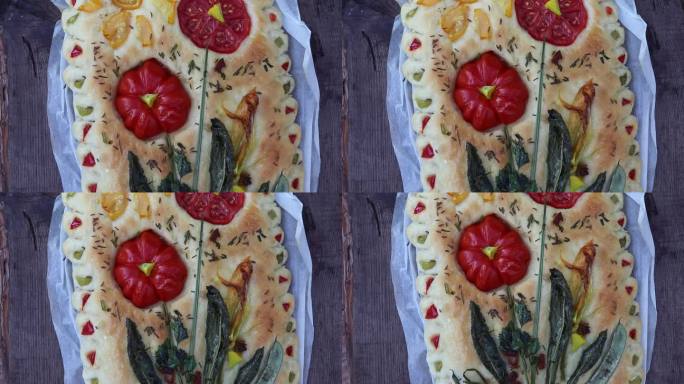 开胃的烤佛卡夏面包配上西红柿和其他蔬菜放在木桌上，还有自制的糕点