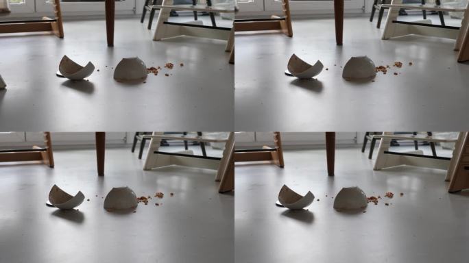 一个碎碗躺在地板上