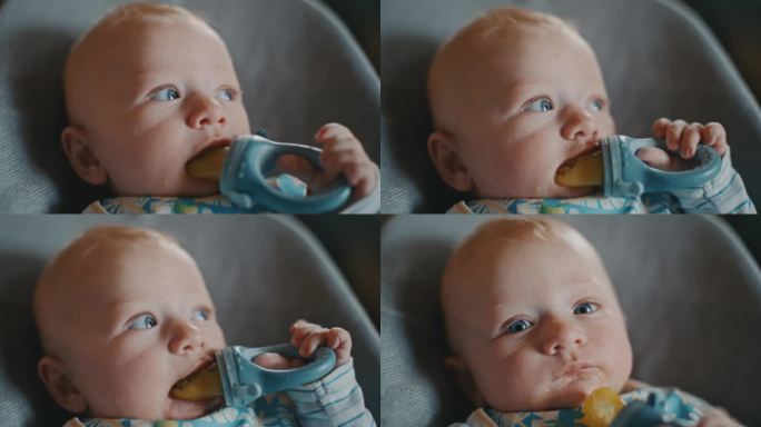 一个可爱的小男孩在家里享受着从奶嘴里拿出来的芒果泥。这个亲密的手持视角捕捉到了小家伙喂食时可爱的混乱