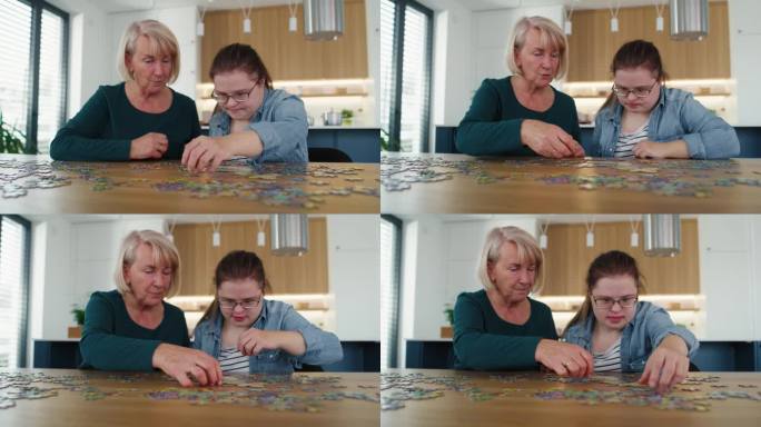 患有唐氏综合症的女人和她妈妈在家里拼拼图。用RED氦相机在8K下拍摄。