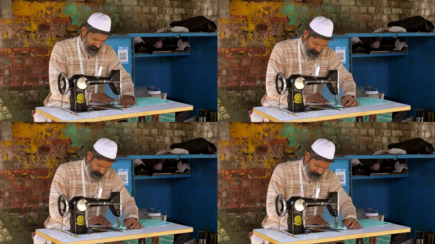 印度穆斯林男子在缝纫机上缝制衣服，戴着头盖帽的男子，低薪工人，自雇