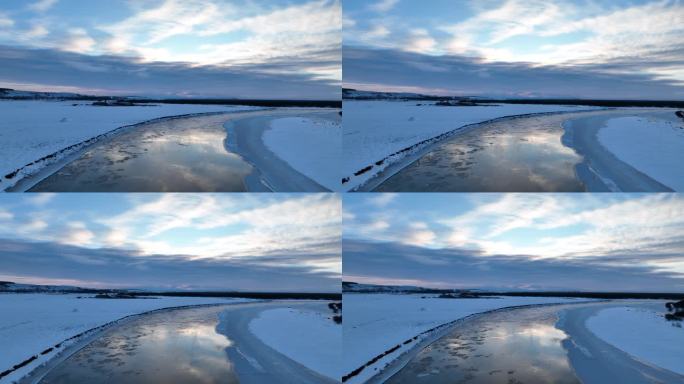 航拍流淌冰凌冰封的河流