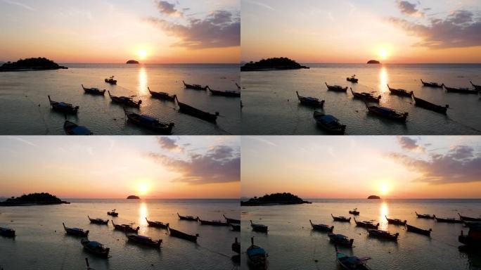 鸟瞰图的海洋和轮廓渔船在日出，利比岛，沙卡通，泰国