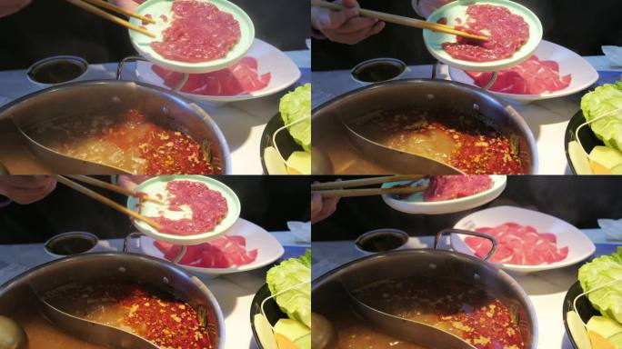 吃火锅涮锅下菜沸腾的锅底嫩牛肉