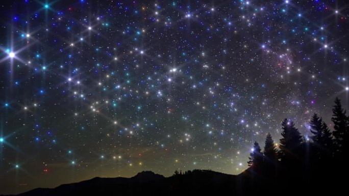 夜空中有山峰上空星星的剪影，光线的效果