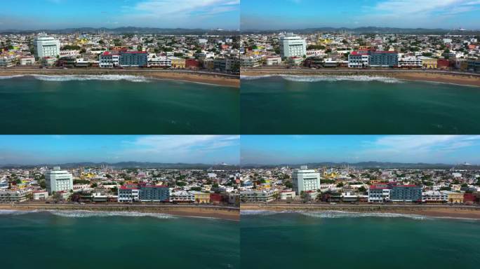 在阳光明媚的墨西哥，马萨特兰的海滩和城市景观的空中跟踪拍摄