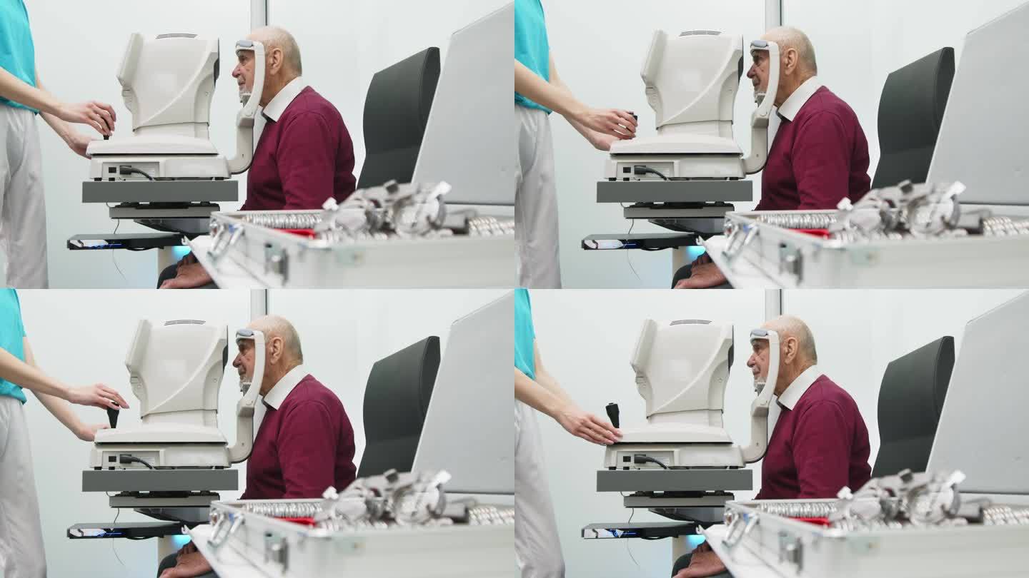 一位老人在一家现代化的诊所里接受眼科检查。专家使用眼科诊断设备检查视力。
