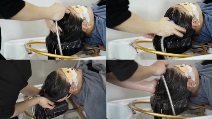 女人洗头发美容院视频素材