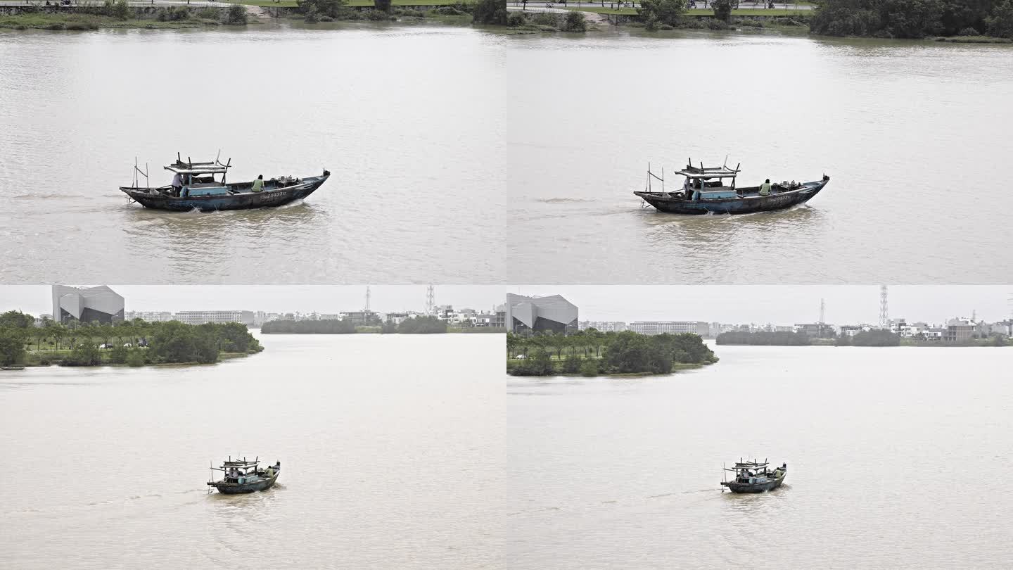 江河上行驶的渔船