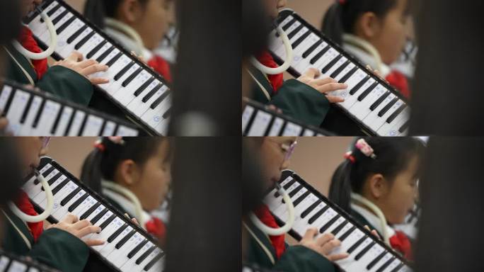 小学生音乐课吹口风琴实拍特写原素材