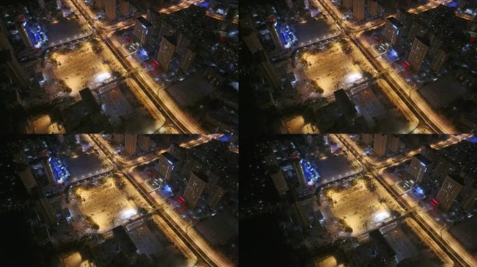 航拍俯瞰威海市高新区高新广场雪后夜景灯光
