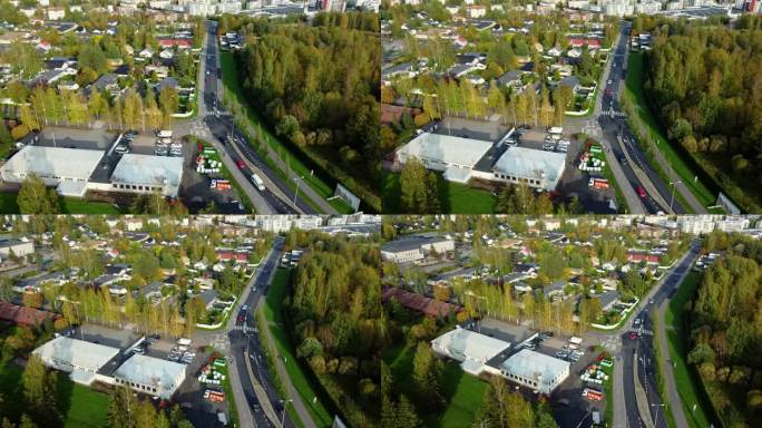 在芬兰南部城市Järvenpää，自行车道和主干道旁的一个小坦克上空的空中轨道。有许多绿色植物的村庄