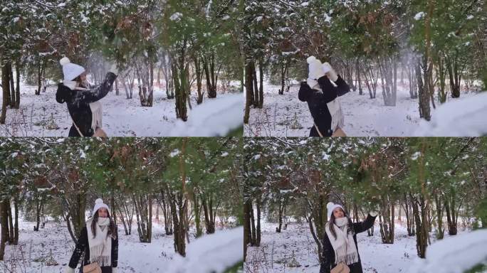 开朗的年轻女子在冬季公园里抖雪，在雪下玩耍