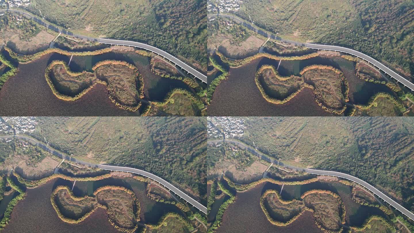 中国江苏省苏州市西岛湿地山地道路高角度视角，4k实时画面，无人机视角。