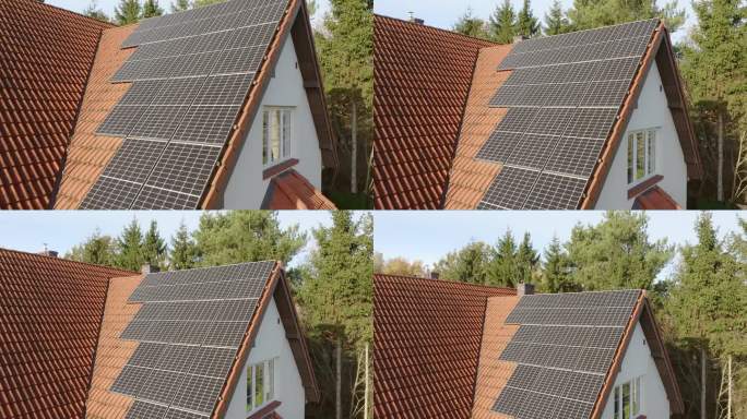 在瓦片屋顶上由固态硅晶体制成的单晶太阳能组件。