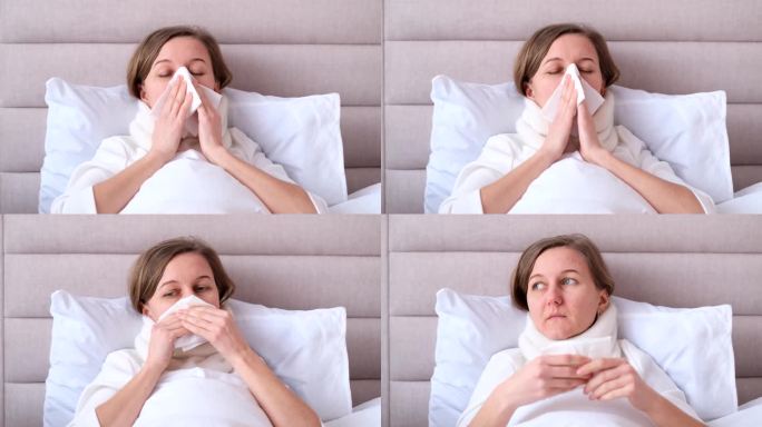 在家请病假。一个年轻女子流鼻涕，得了普通感冒。对着纸巾打喷嚏。