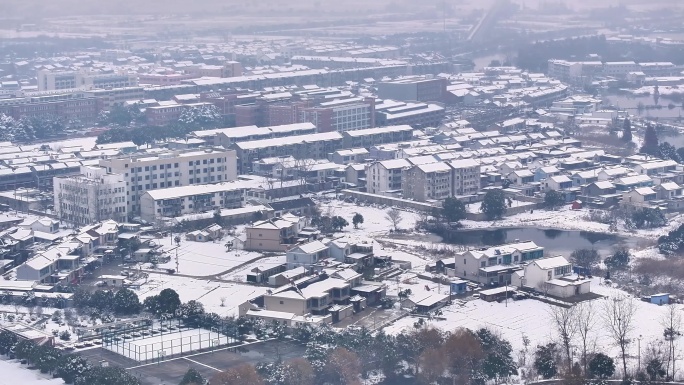 航拍乡镇雪景学校建筑田地大桥别墅河流房屋