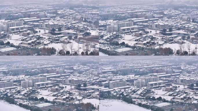 航拍乡镇雪景学校建筑田地大桥别墅河流房屋