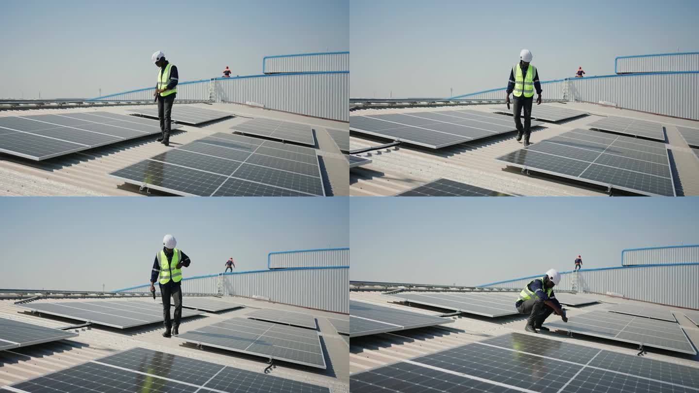 可持续能源在行动:非洲维修工人检查光伏太阳能电池板。