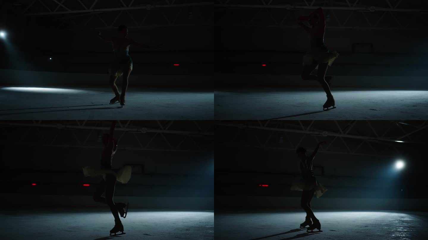 优雅的年轻女子花样滑冰运动员在黑暗中滑冰和旋转，慢动作镜头