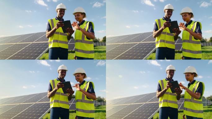 拿着数码平板电脑的男女工程师正在检查产生可再生能源的太阳能电池板