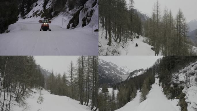 雪地中驾驶雪地摩托下山