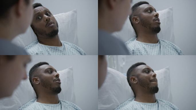 一名非裔美国男子在手术前咨询医生