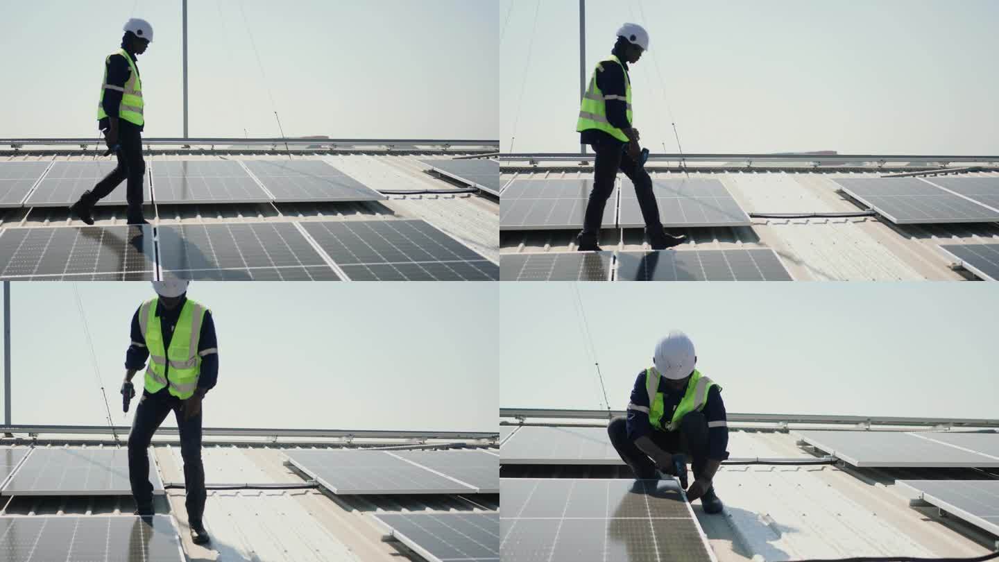 可持续能源在行动:非洲维修工人检查光伏太阳能电池板。