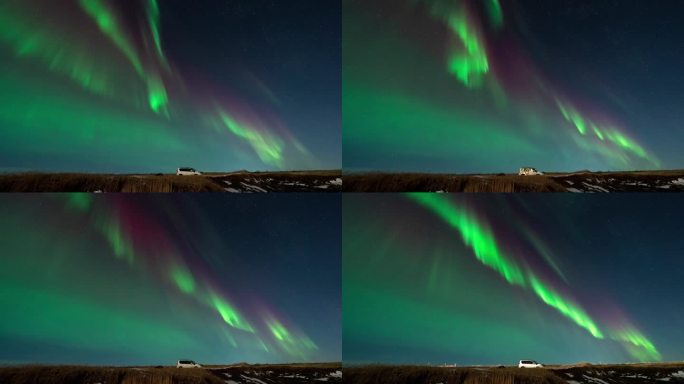 延时拍摄的闪烁的绿色和紫色的北极光在冰岛的夜空与停在道路上的汽车