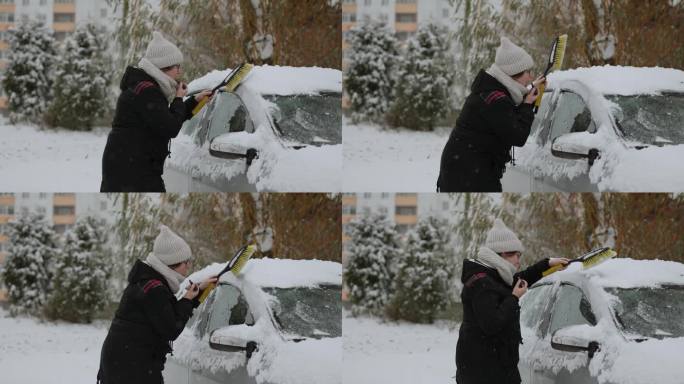 漂亮女人一边擦车里的雪，一边涂嘴唇。