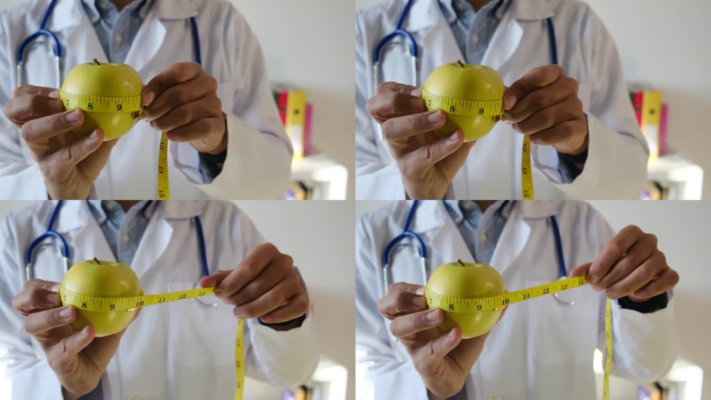 图为，一位营养学家医生正在用卷尺测量苹果