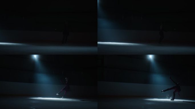 女子花样滑冰运动员穿着闪亮的服装在冰上滑倒并表演跳跃