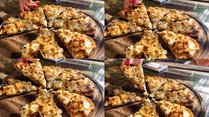 女人用木盘端出热腾腾的开胃披萨。4k视频片段UHD 3840x2160